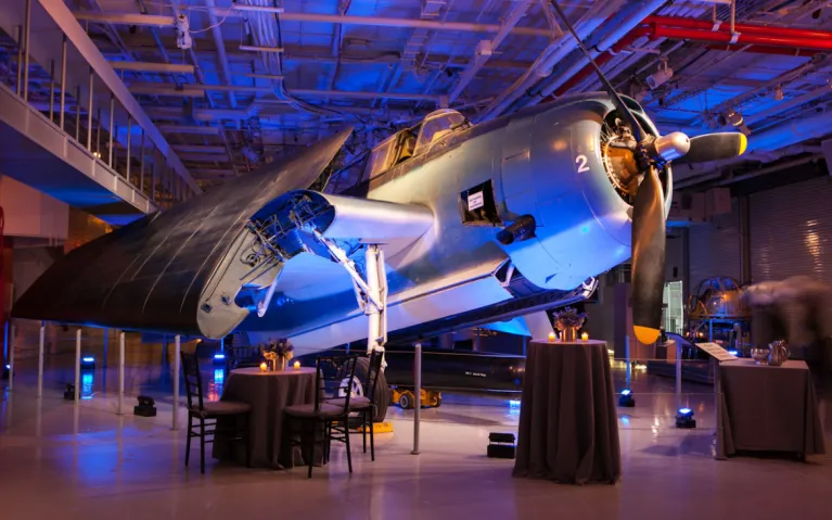 Tables and lighting set in Hangar 2 for a cocktail reception