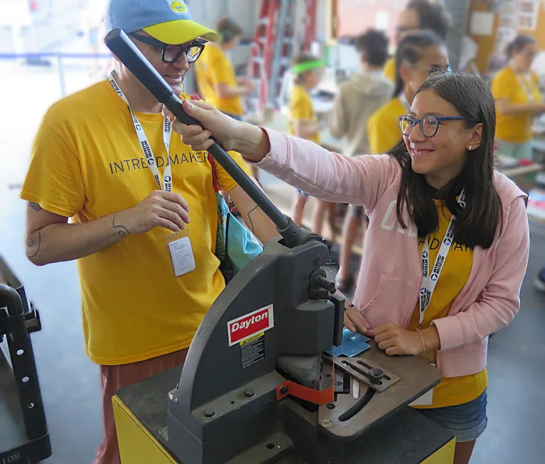 Two all access campers doing an activity at the intrepid museum