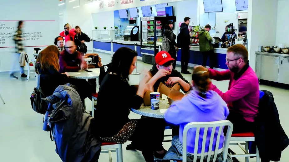 Museum visitors are eating in the Aviator Grill.