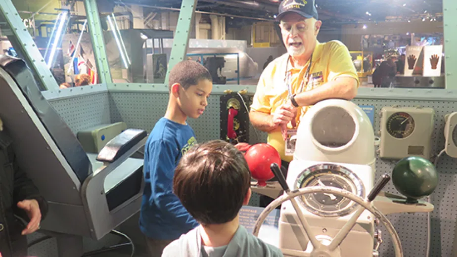 military family appreciation month image of veteran talking to children