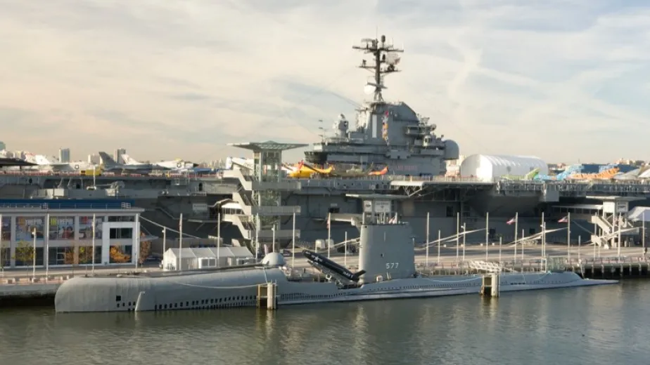 an image of the uss growler submarine in front of the uss intrepid