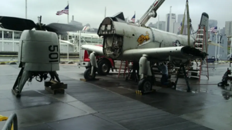 The Skyraider is assembled on the pier after arrival from Naval Air Station Oceana, where it was displayed for decades since its retirement.