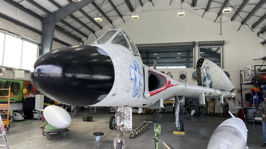 Aircraft inside a tent.