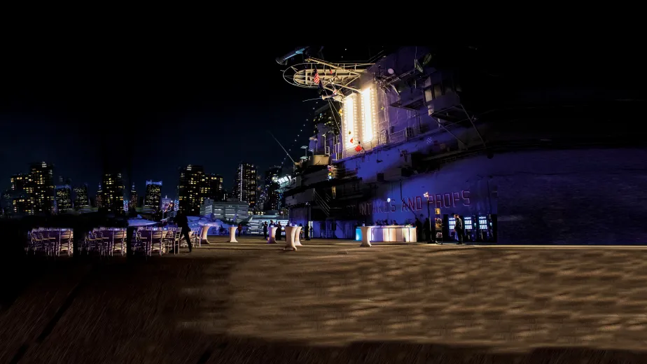 Event setup at the Intrepid Flight Deck with a view of the Manhattan skyline.