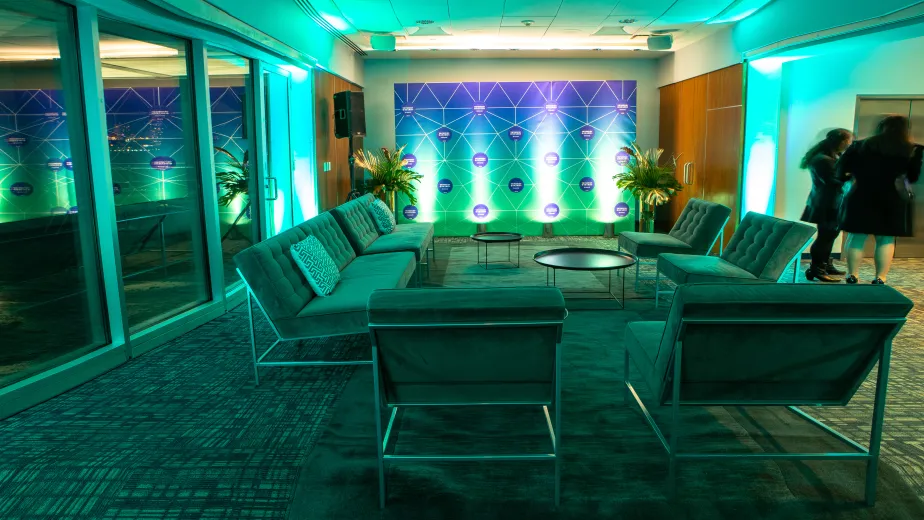 Couches and armchairs in the VIP Room with ambient lighting
