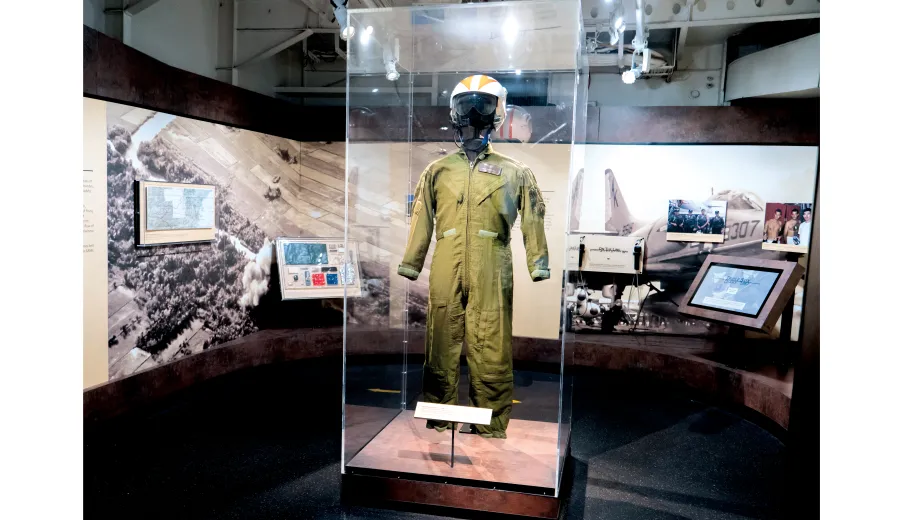 Fighter Pilot uniform with helmet in an exhibition case