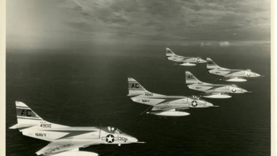 A squadron of jet planes flies in formation.