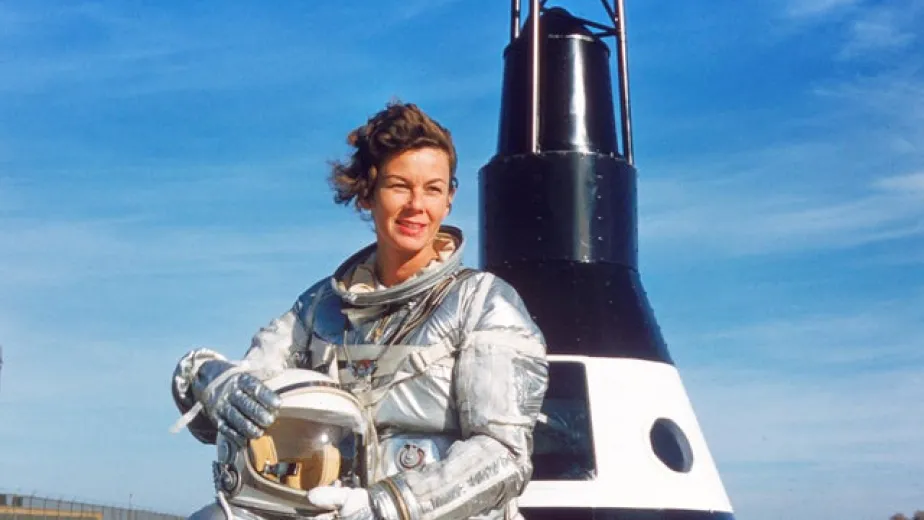 Betty Skelton in front of the Mercury Capsule Replica.