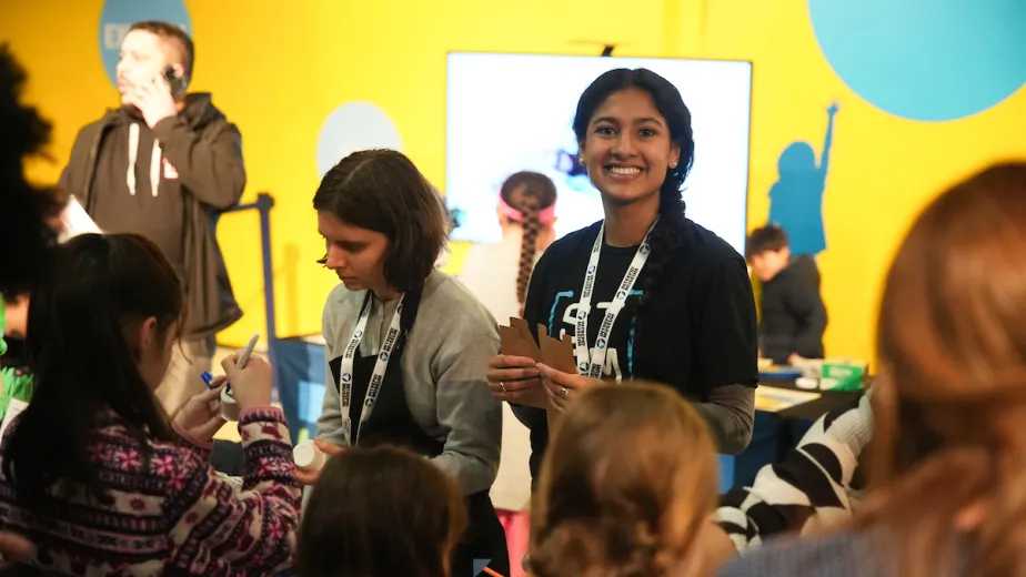 A group of people at the museum participating in activities.