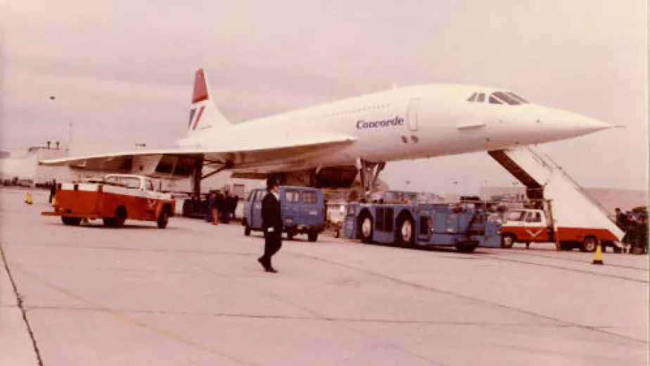 British Airways Concorde docked with cargo around it.