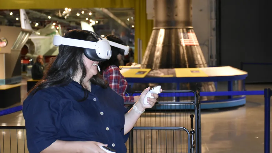 Guest explores the Intrepid's engine room through an immersive VR experience