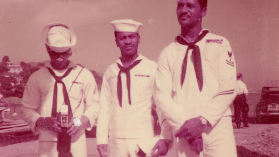 Archival photo of three sailors