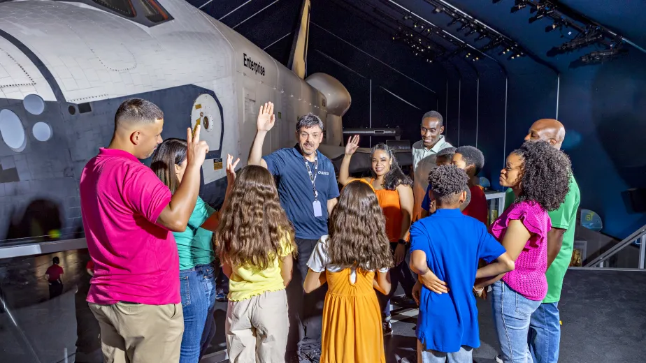 Guests on a highlight tour of the Intrepid Museum.