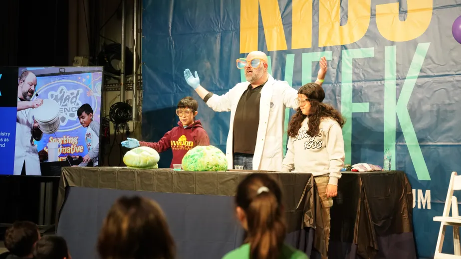 Kids and instructors on stage aboard Intrepid during Kids Week