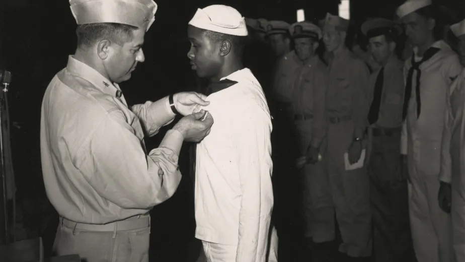 Captain Bolger Awards Medal to Eli Benjamin