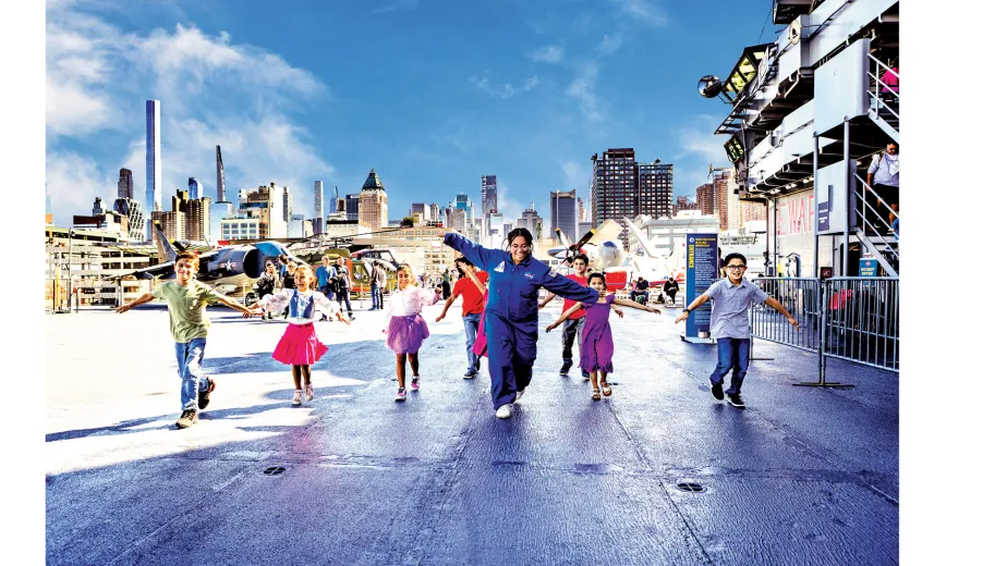 Birthday party guests enjoying an exciting experience high above the Hudson on the Intrepid Museum’s Flight Deck.