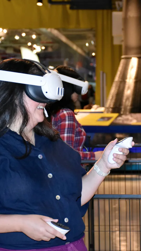 Guest explores the Intrepid's engine room through an immersive VR experience